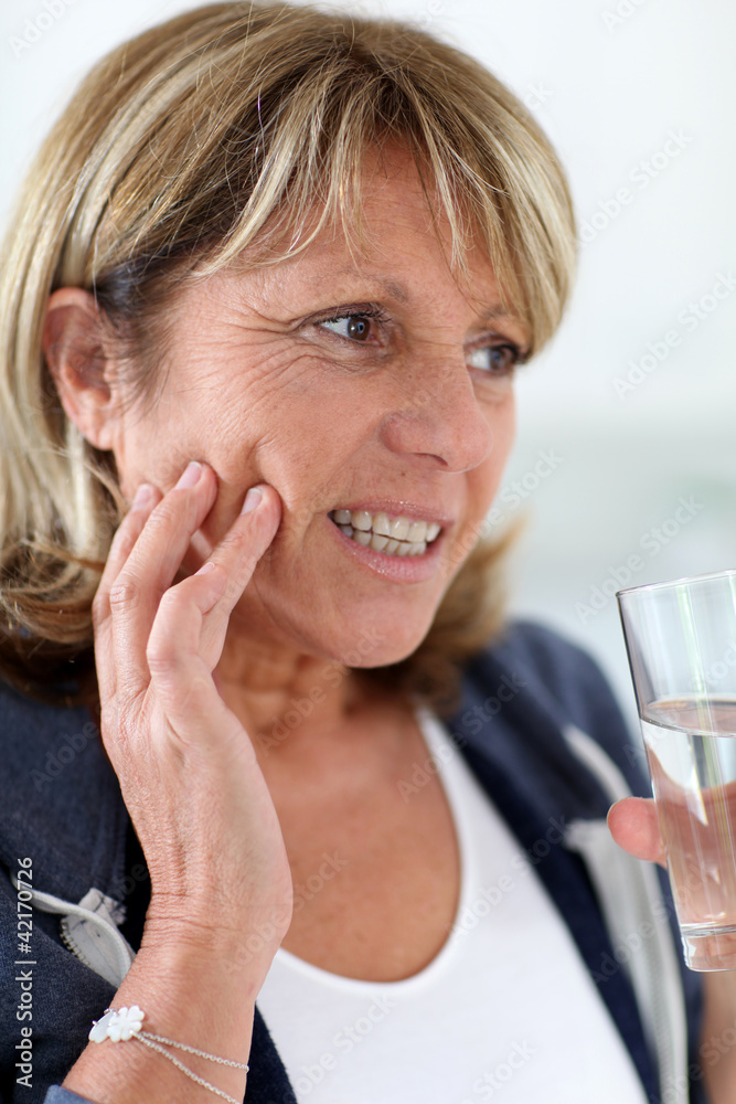 Closeup of senior woman having toothache - obrazy, fototapety, plakaty 