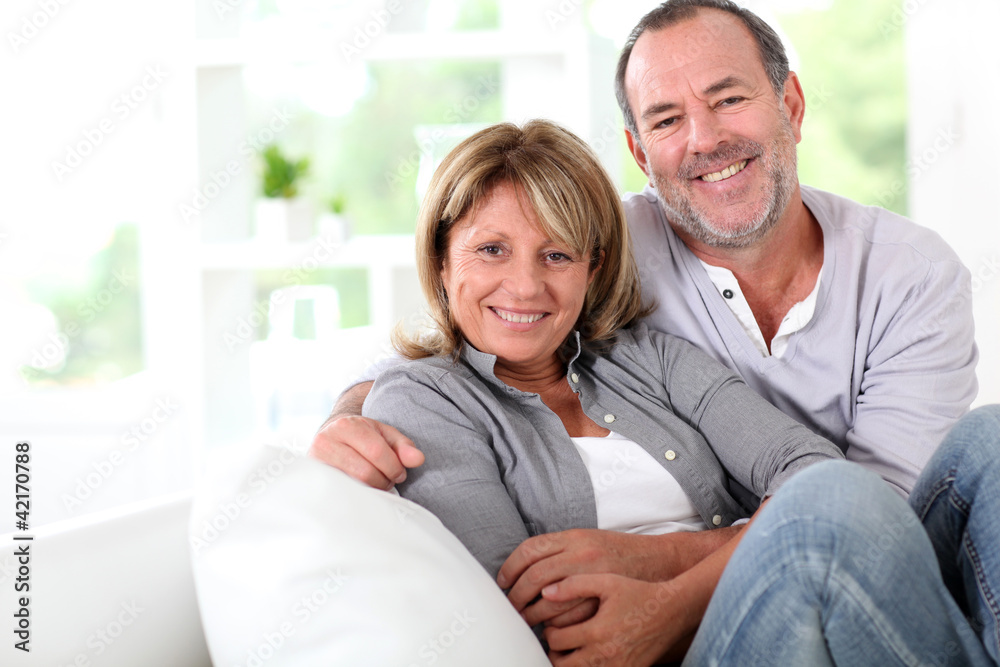 Cheerful senior couple enjoying being at home Cheerful senior couple enjoying being at home