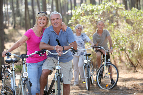Two elderly couples on bike ride