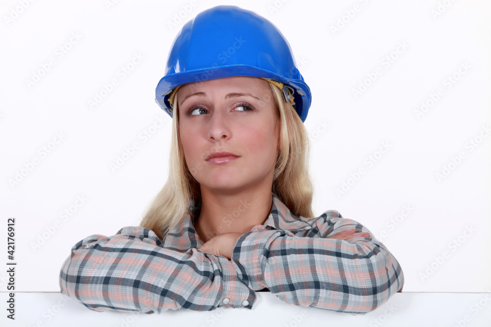 Female builder with confused look on her face Female builder with confused look on her face