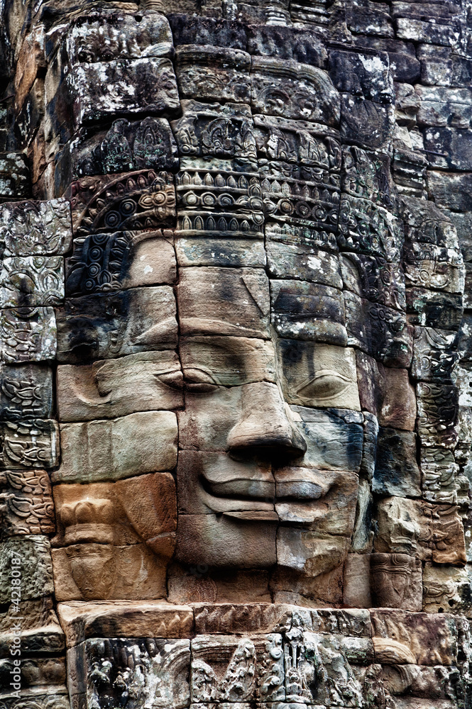 Stone bas-relief of Buddha in the temple of Angkor Thom.