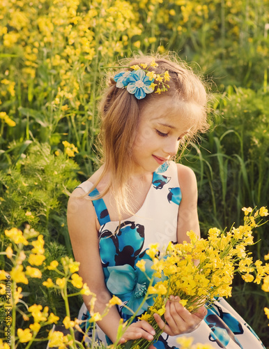 smile girl in rape field photo