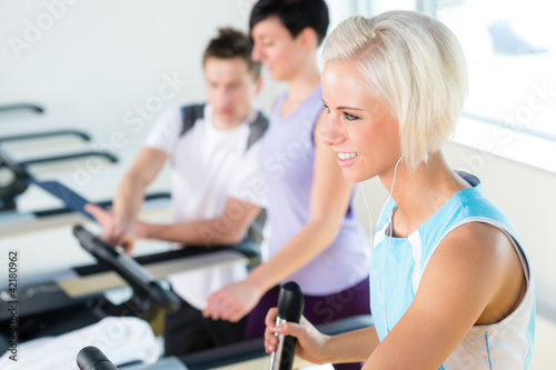 Fitness young people on treadmill cardio workout