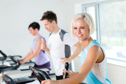 Fitness young people on treadmill running exercise