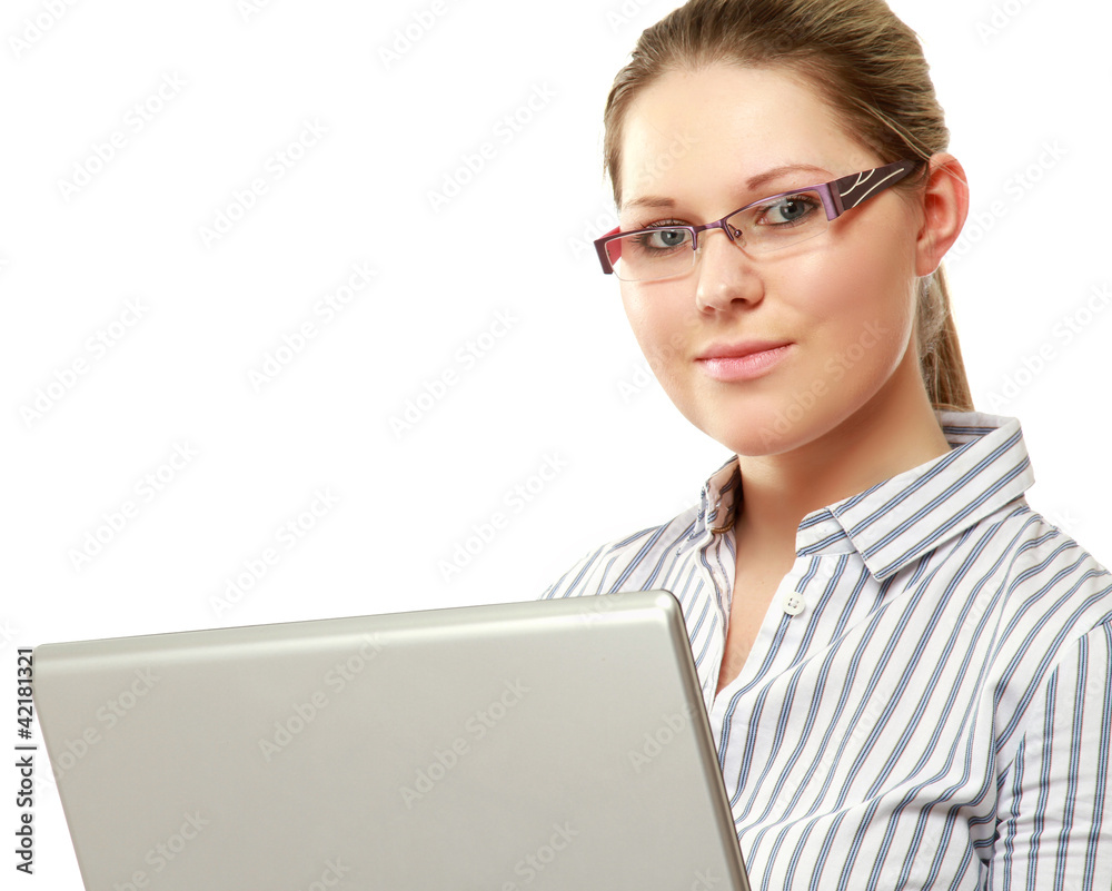 A young woman wearing glasses in front of a laptop A young woman wearing glasses in front of a laptop
