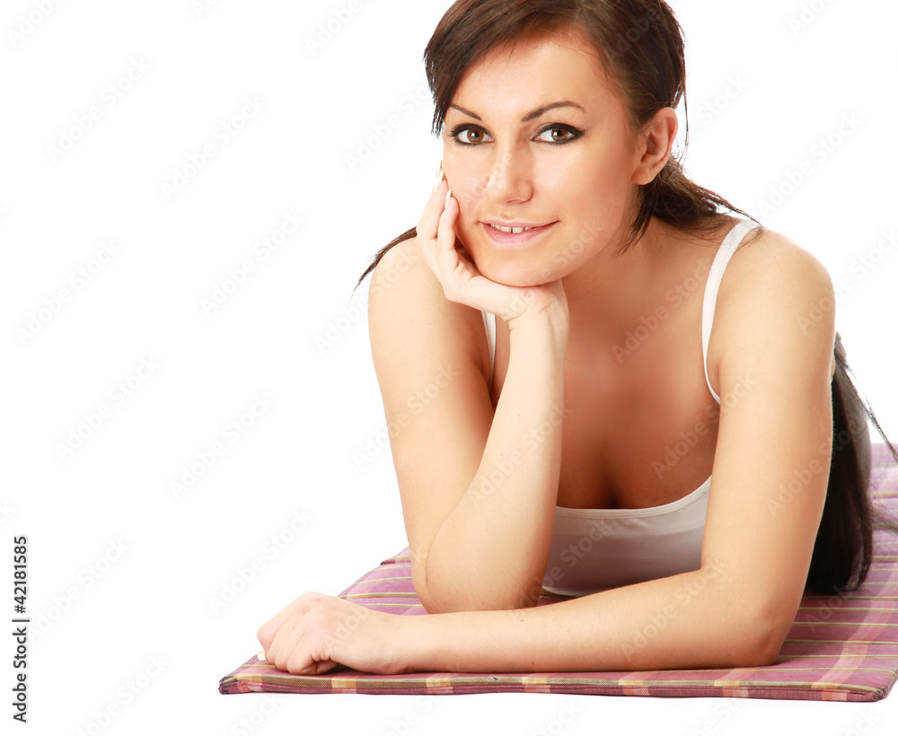 A young sportive girl lying on the floor A young sportive girl lying on the floor