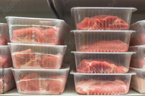 Variety of meat in plastic box in supermarket