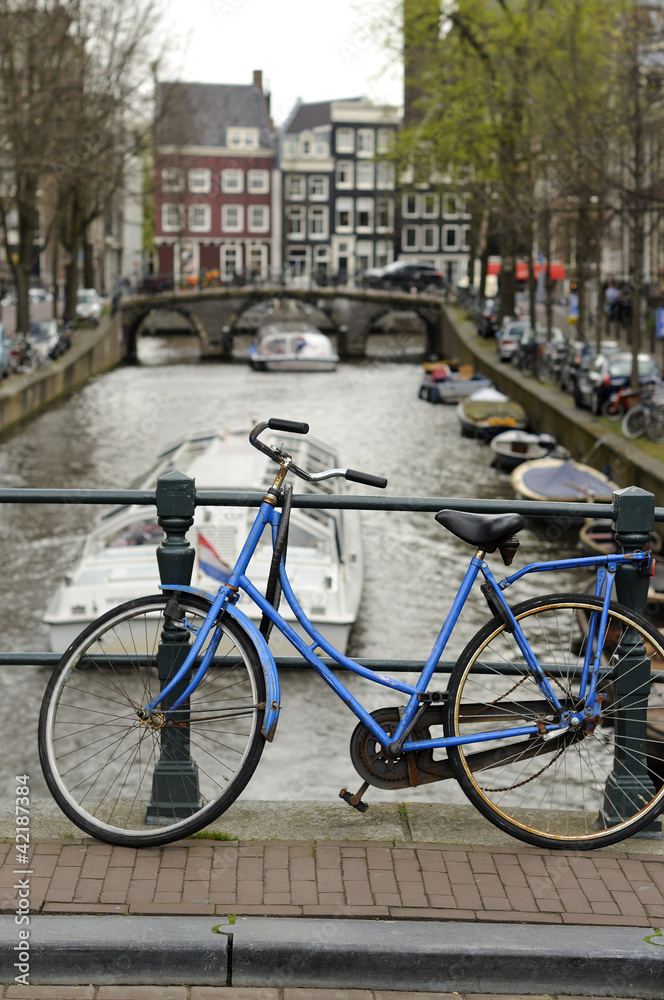 blue bike on canal, amsterdam