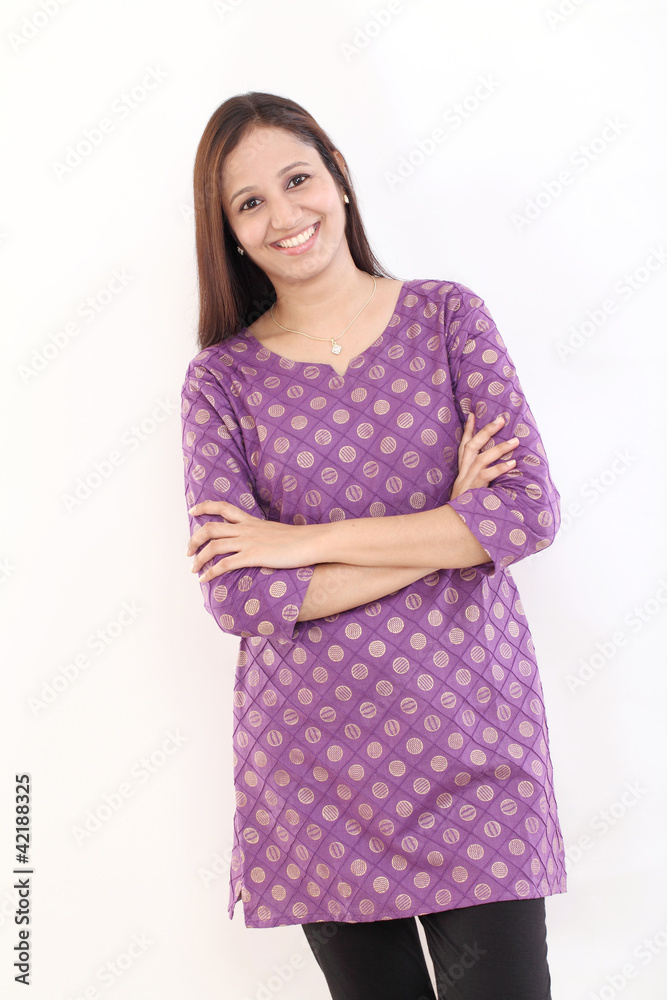 Smiling indian woman with arms crossed Smiling indian woman with arms crossed