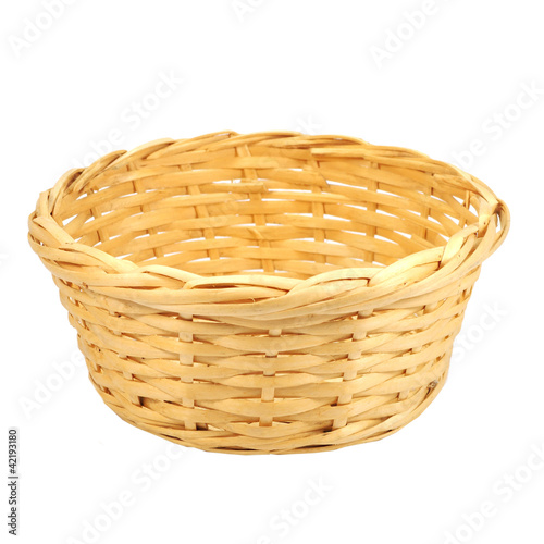 Round woven straw basket isolated on the white