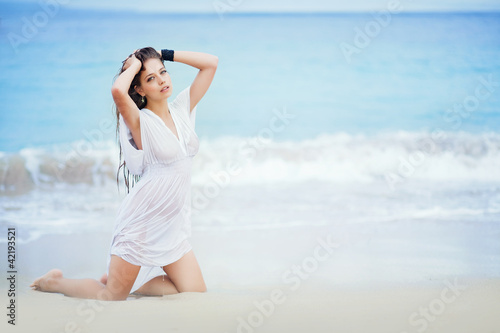 sexy wet woman near ocean