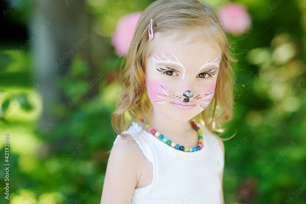 Adorable little girl with her face painted Adorable little girl with her face painted