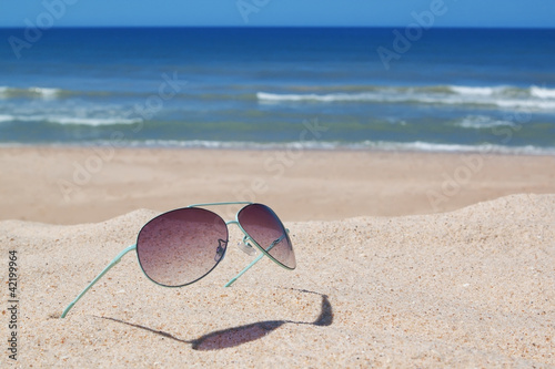 Glasses on the beach. Seascape.