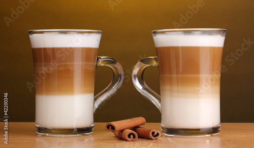 Fragrant сoffee latte in glass cups and cinnamon