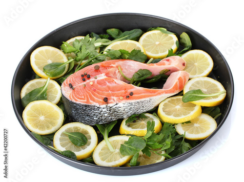 Red fish with lemon, parsley and pepper