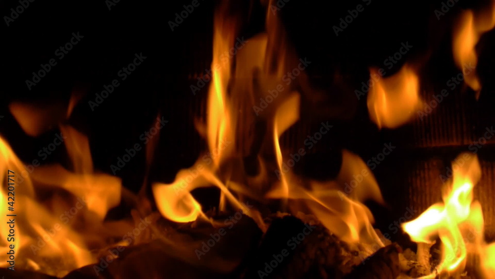 Fire in fireplace on dark background Fire in fireplace on dark background