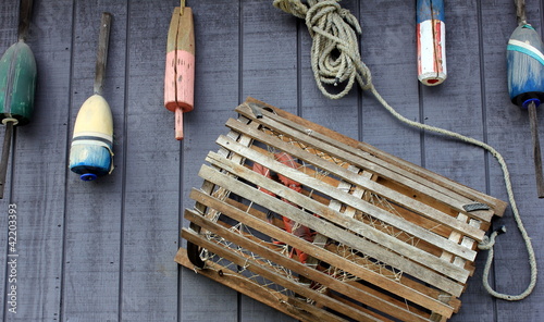 Lobster trap and colorful buoys photo