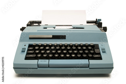 Blue electric typewriter on white