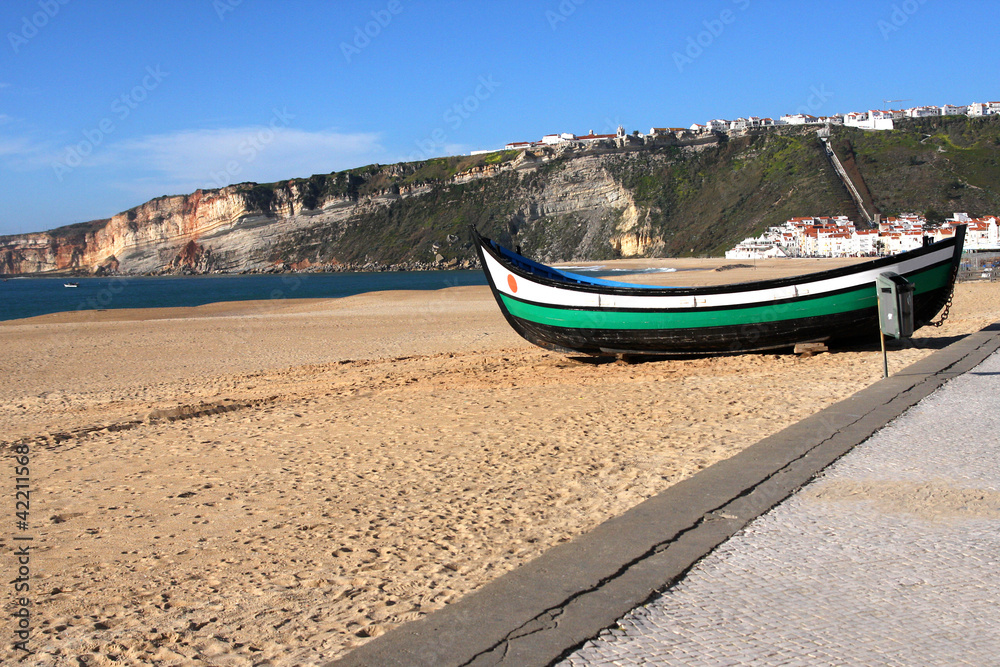 boat on the beach in nazare