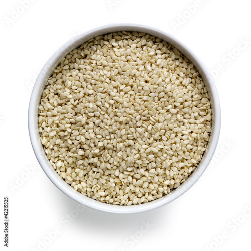 Sesame Seeds in White Bowl over White Overhead View