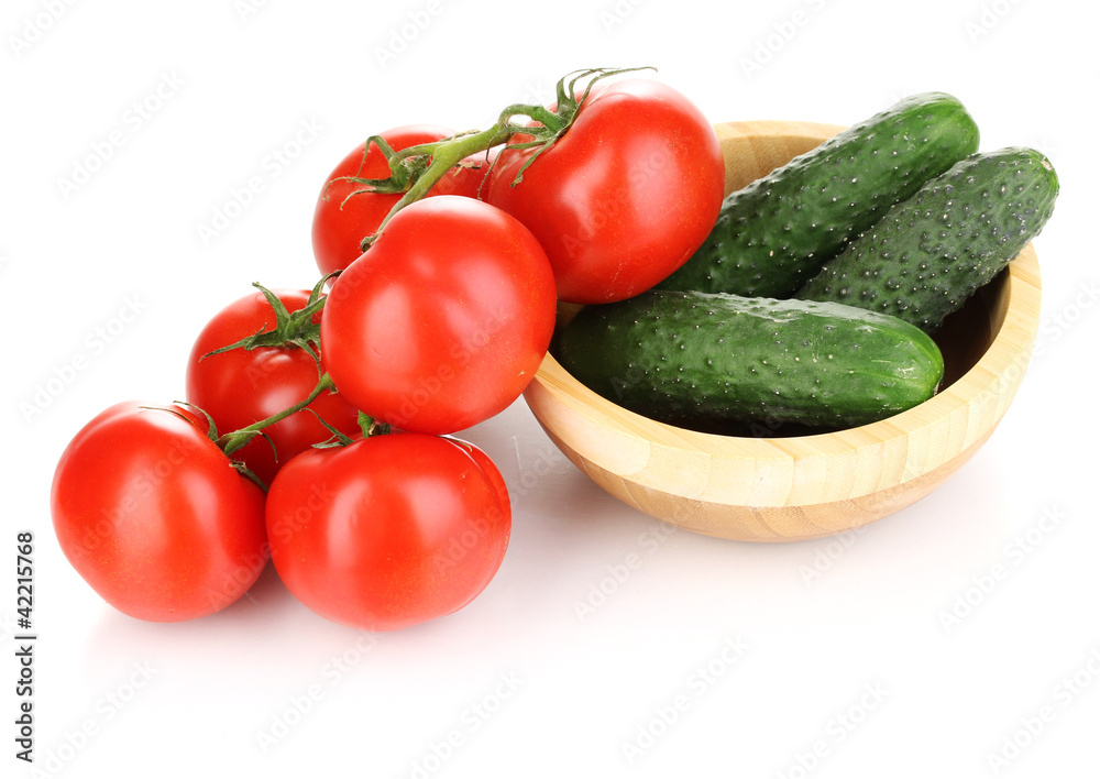 Tomatoes and cucumbers isolated on white Tomatoes and cucumbers isolated on white