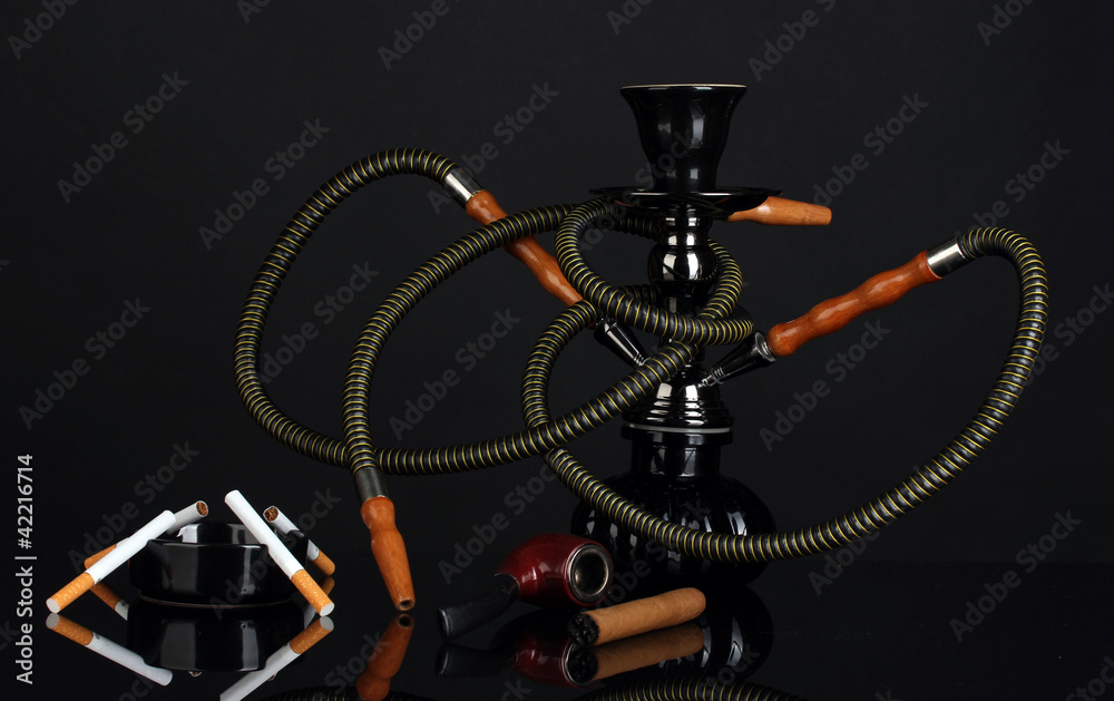 hookah, cigar, cigarette and pipe isolated on black