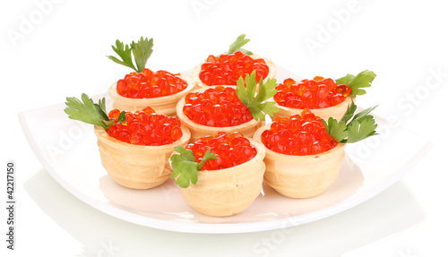 Red caviar in tartlets on white plate isolated on white