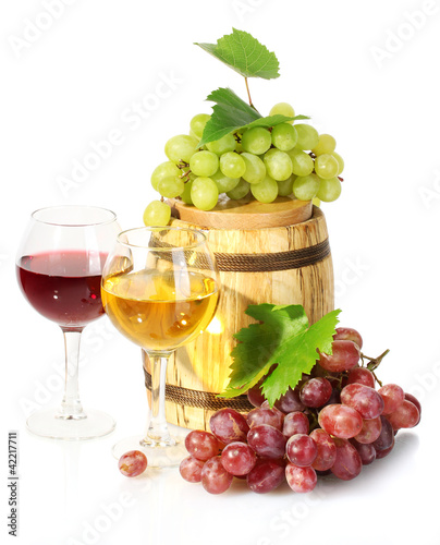 barrel and glasses of wine and ripe grapes isolated on white