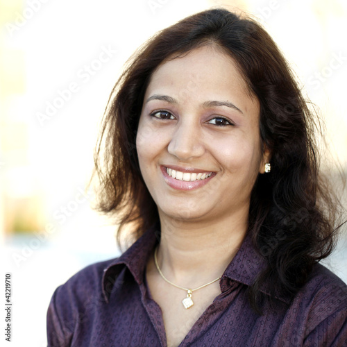 Portrait of young happy Indian woman