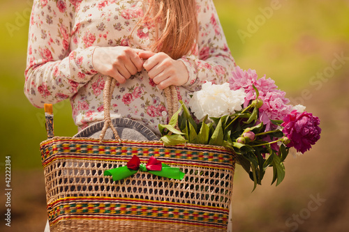 Stock Photo: Village girl with a basket in hand