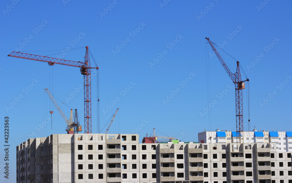 crane and blue sky on building site crane and blue sky on building site