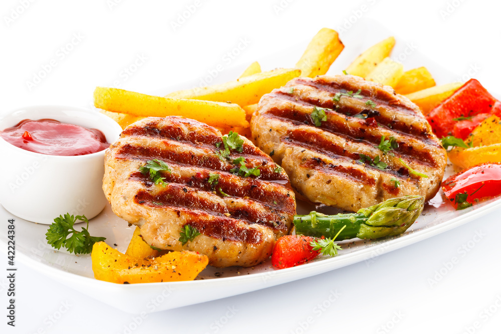 Grilled steak, French fries and vegetables Grilled steak, French fries and vegetables