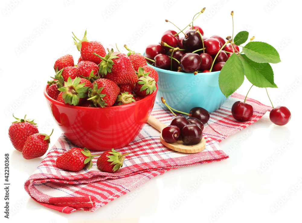 Ripe strawberries and cherry berries in bowls isolated on white Ripe strawberries and cherry berries in bowls isolated on white