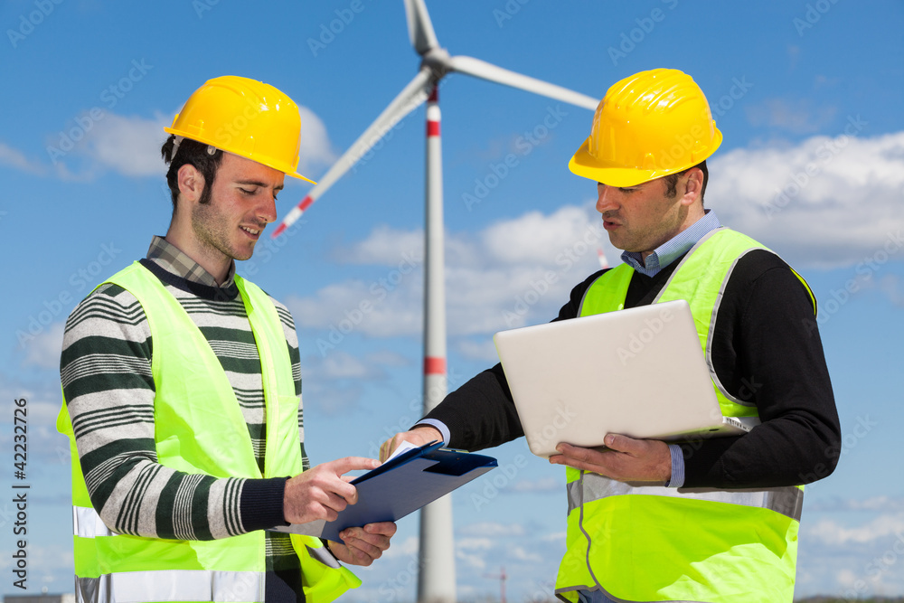 Two Engineers in a Wind Turbine Power Station Two Engineers in a Wind Turbine Power Station