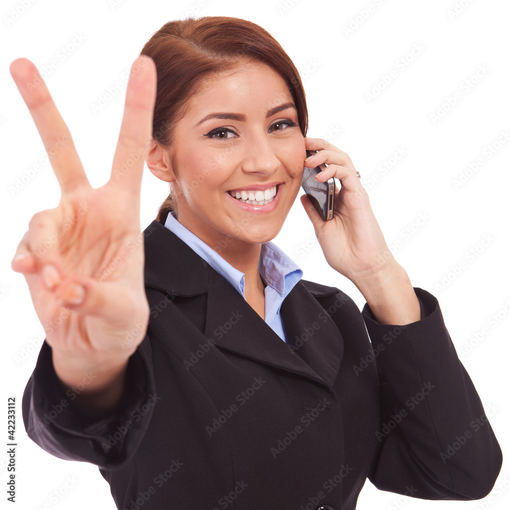 woman with phone and victory gesture woman with phone and victory gesture