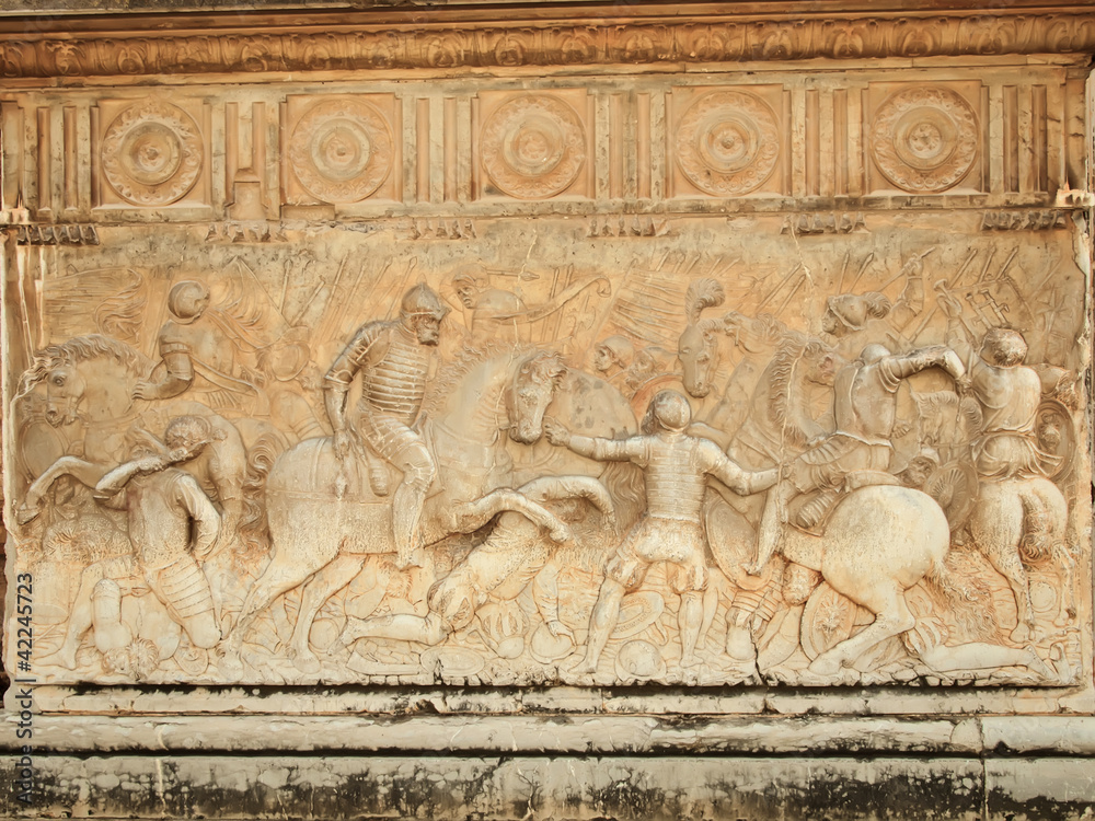 Alhambra, wall of Carlos V Palace. Relief carving of a battle sc