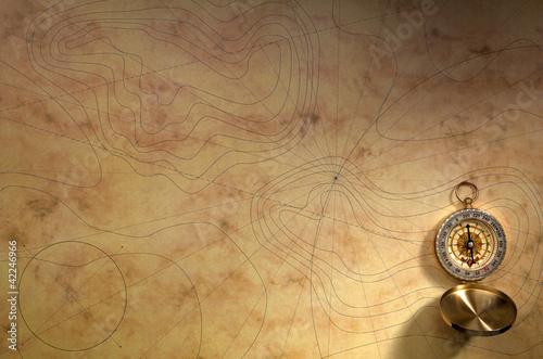 Compass on the old paper background