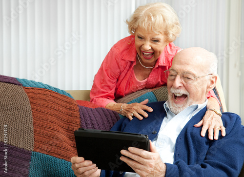 Tablet PC - Senior Couple Laughing photo