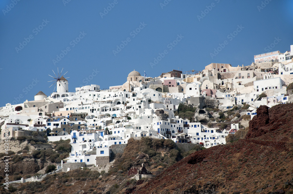 Oia clinging to clifftop on the Island of Santorini Greece
