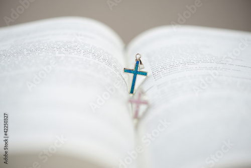 Bible and two Cruxific in the middle of bible photo