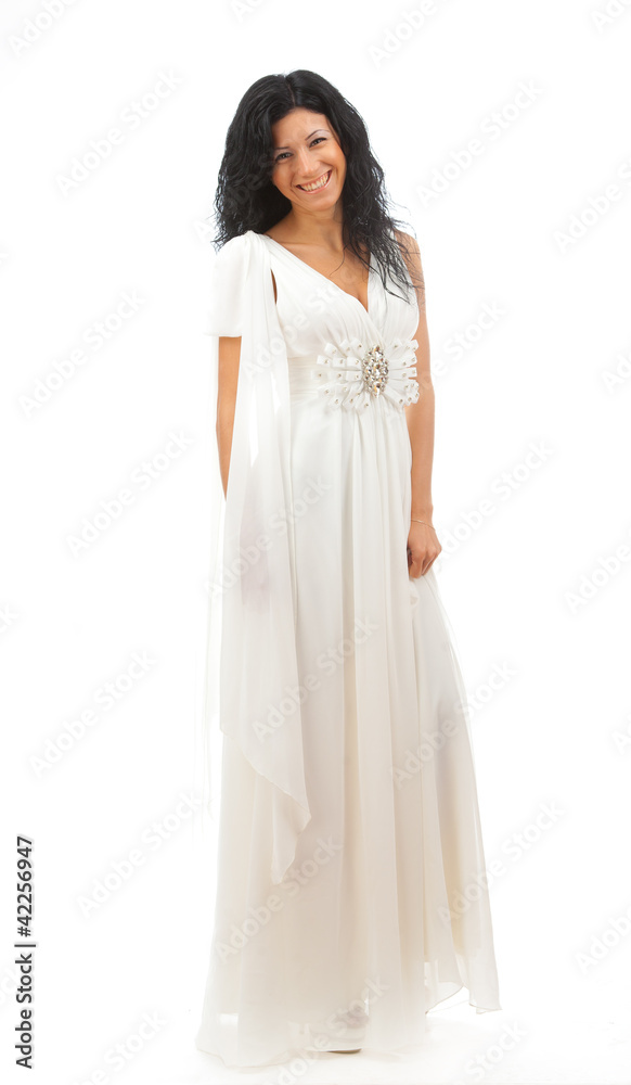 Beautiful girl in white dress standing on white background. Beautiful girl in white dress standing on white background.