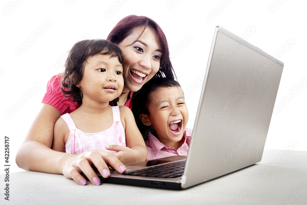 Happy family using laptop Happy family using laptop