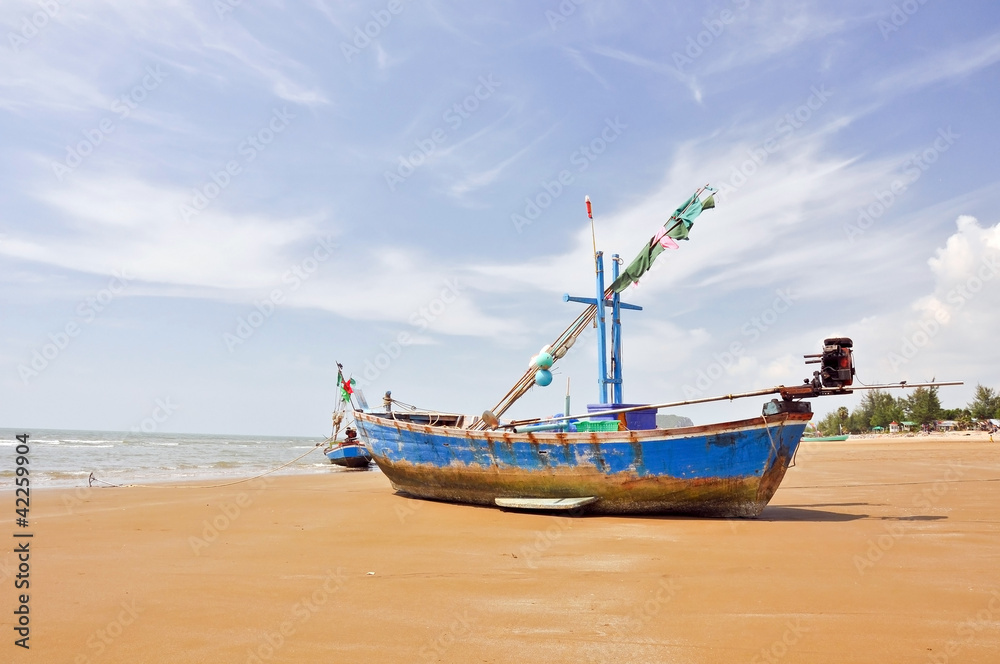 wooden fishing boat on the beach