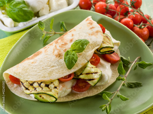 piadina with mozzarella, grilled zucchinis and tomatoes photo