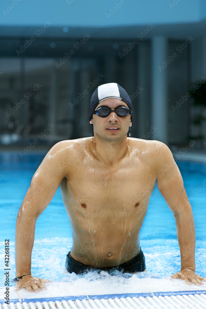 Young handsome swimmer