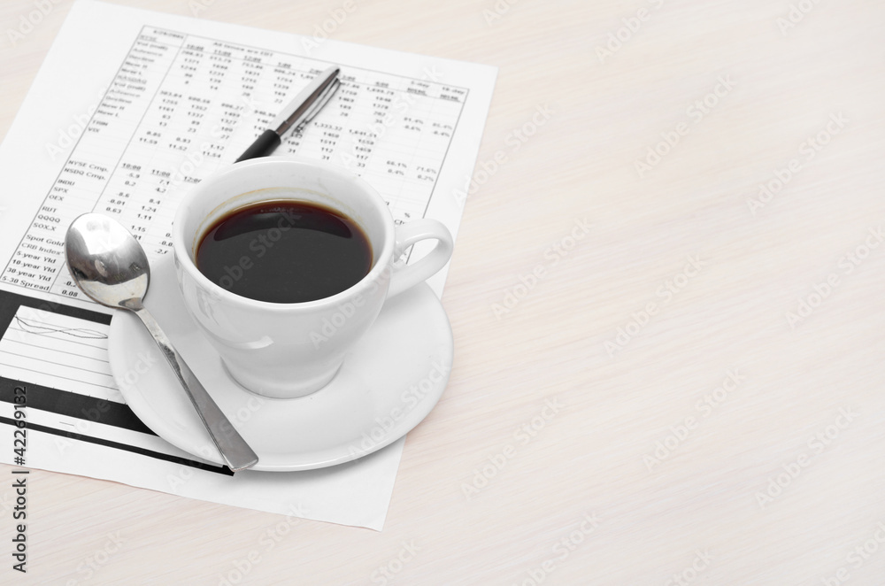 Accounting. Cup of coffee on document. chart and diagram Accounting. Cup of coffee on document. chart and diagram