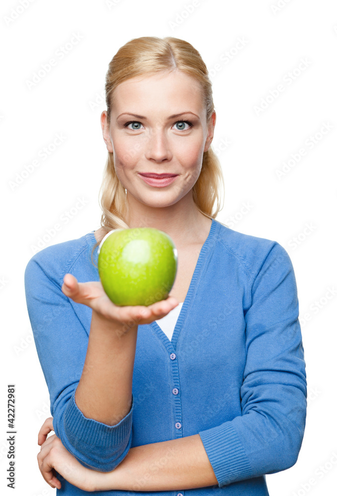 Smiling attractive woman offers a green apple, isolated Smiling attractive woman offers a green apple, isolated