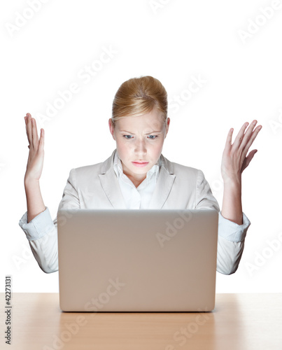 Attractive businesswoman sitting at a office table