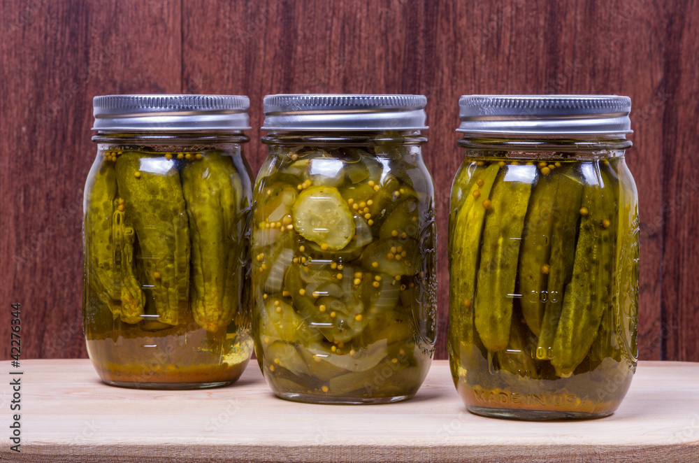 Three jars of pickled cucumbers Three jars of pickled cucumbers