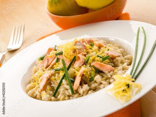 risotto with fresh salmon chive and lemon peel, healthy food